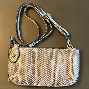 Cross body/clutch. Faux leather/snake skin print with corresponding straps (2).